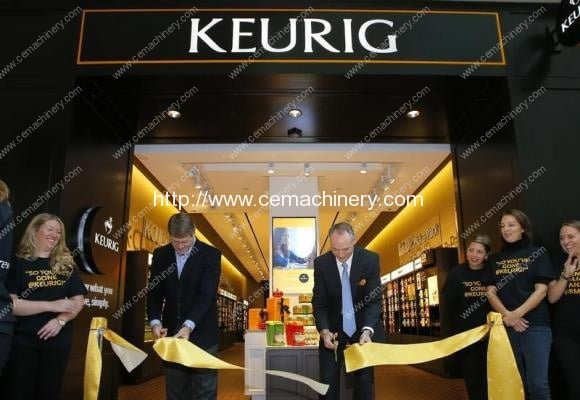 Green Mountain Roasters President and CEO Kelley and Senior Vice President Wood cut the ribbon to open the company's first Keurig retail store in Burlington